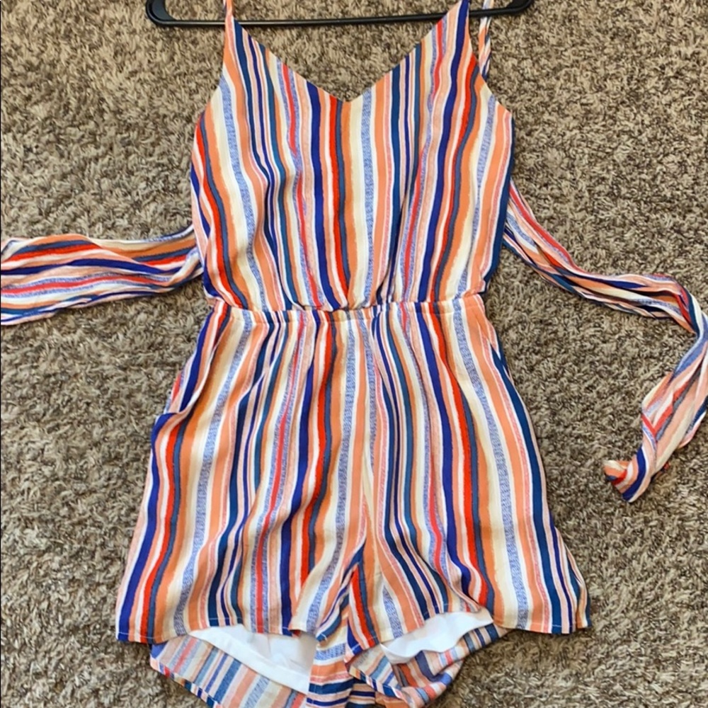 romper. backless. two straps to tie in back.